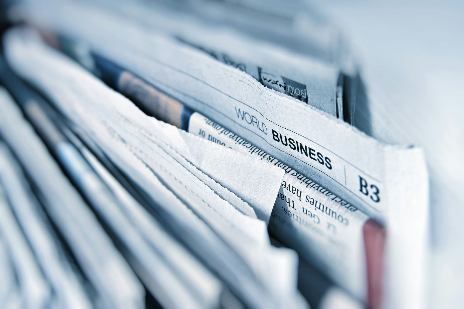 a vertical pile of newspapers