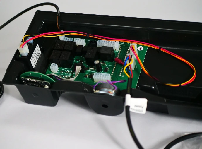 Printed Circuit Board Assembly (PCBA) in a vacuum-formed casing.