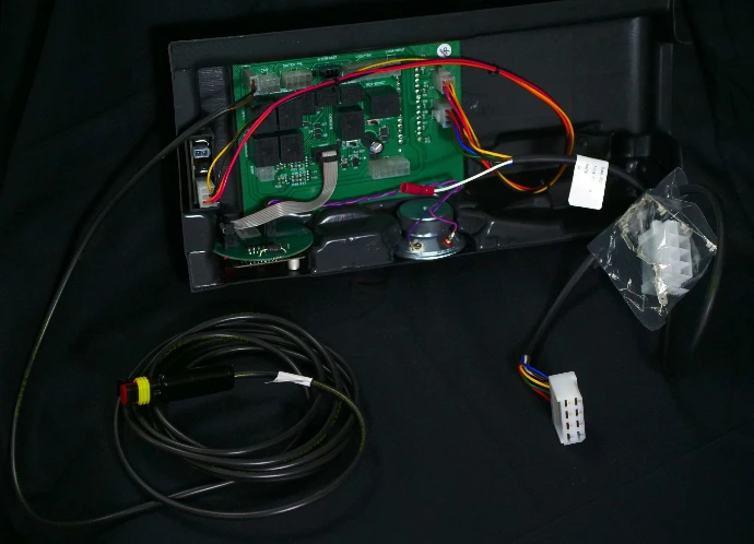 PCB assembly with attached cables and plugs for easy installation