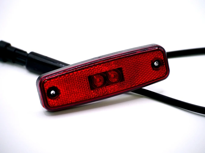 Rear marker light terminated with a cable