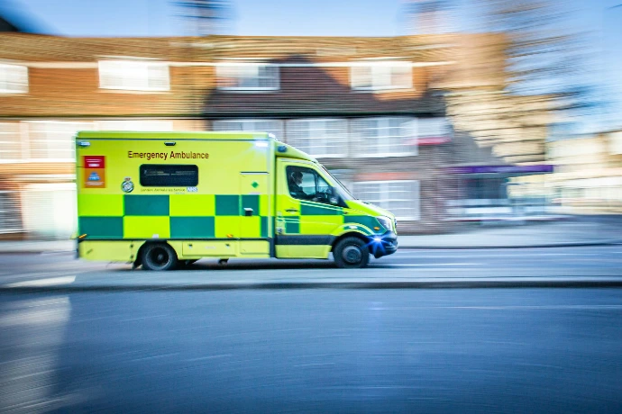 British Ambulance driving down a blurred street