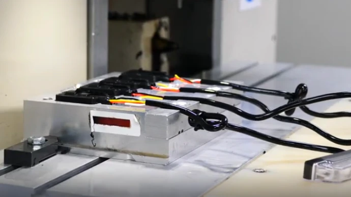 Components before being overmoulded Componets in a mould waiting to be overmoulded. You can see their connecting wires exposed.