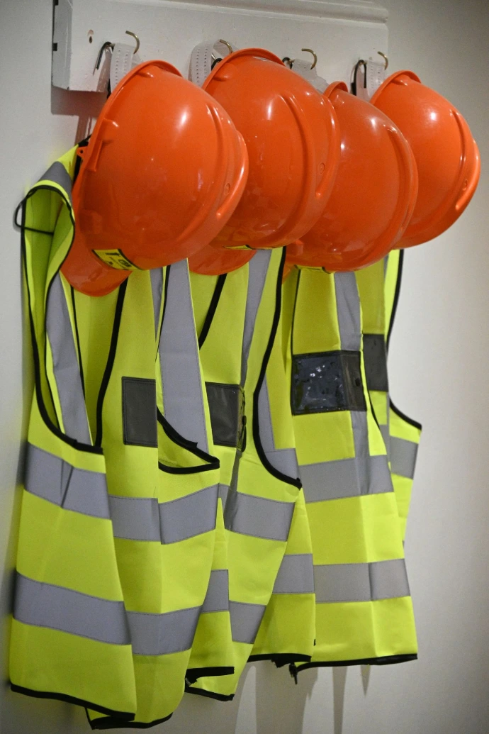 Orange hard hats and yellow Hi- vis jackets