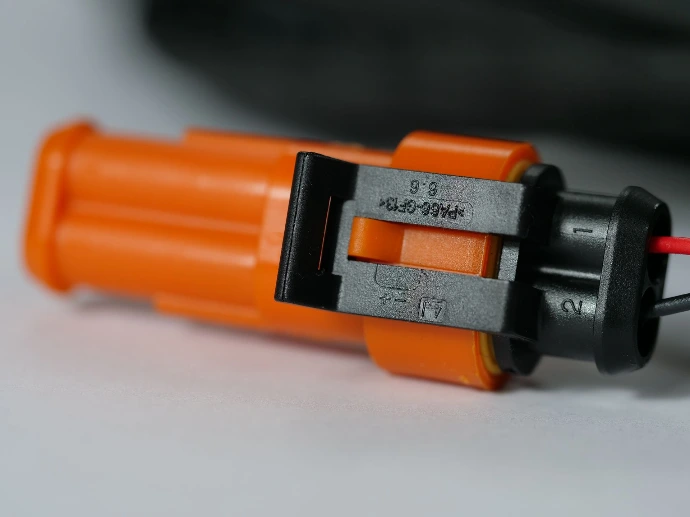 Orange overmoulded connectors on the BSIS loom